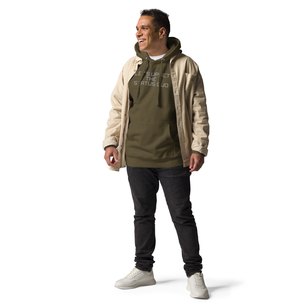 "Let's upset the status quo!" printed on a military green unisex hoodie worn by a male with a jacket on top