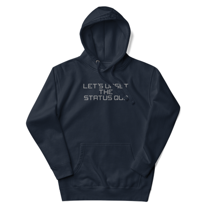 "Let's upset the status quo!" printed on a navy blazer unisex hoodie laying on a flat surface with the hood up