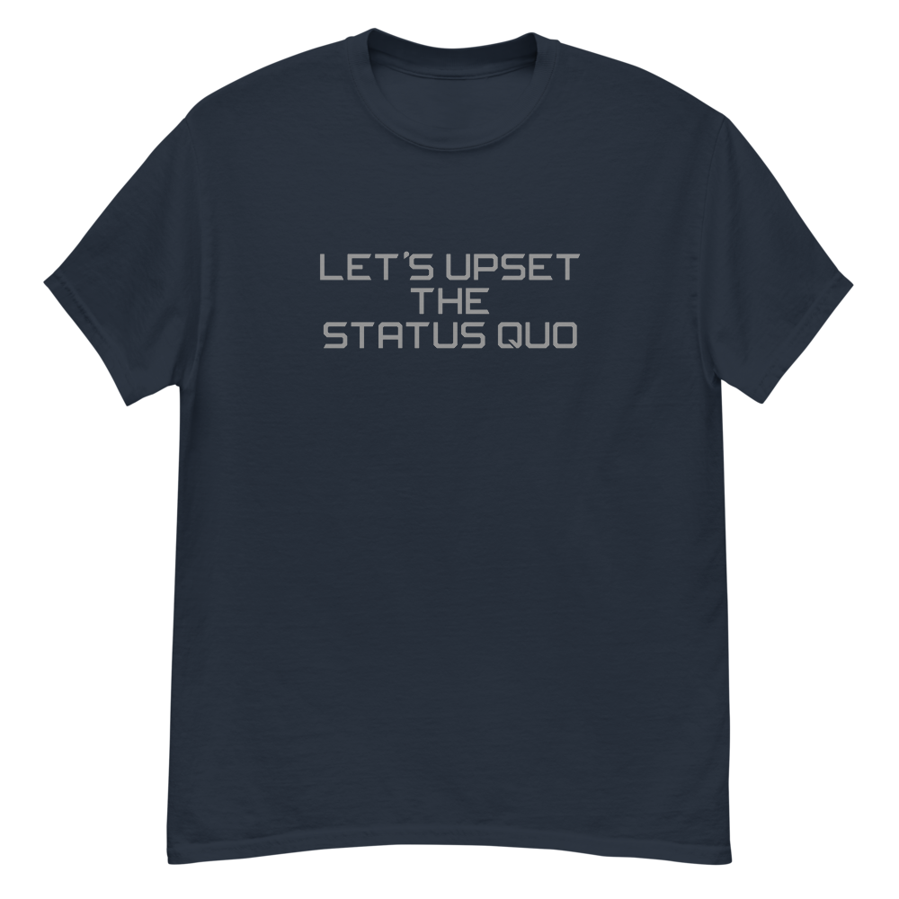 "Let's upset the status quo!" printed on a navy unisex classic tee laying on a flat surface