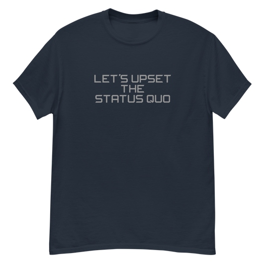 "Let's upset the status quo!" printed on a navy unisex classic tee laying on a flat surface