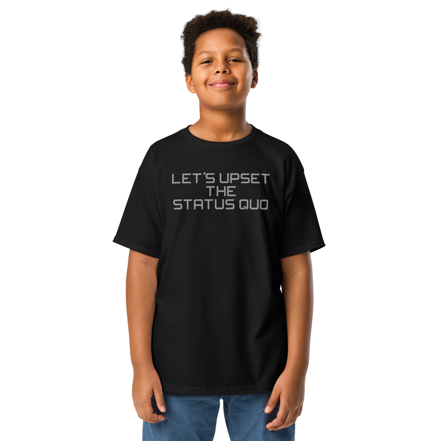 "Let's upset the status quo!" printed on a black youth classic tee worn by a male