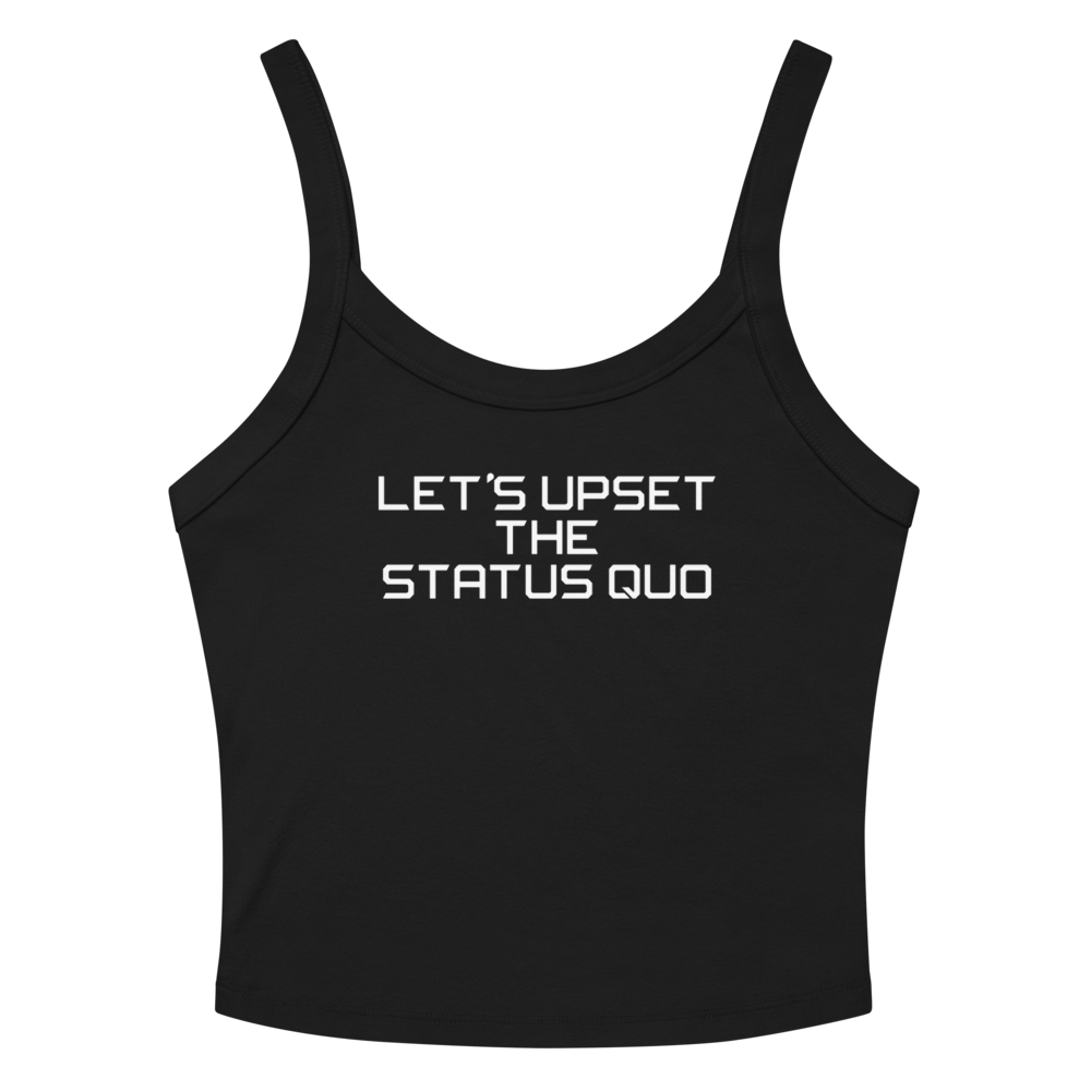 "Let's upset the status quo!" printed on a solid black blend women's micro-rib tanktop laying on a flat surface amongst sunglasses and shorts