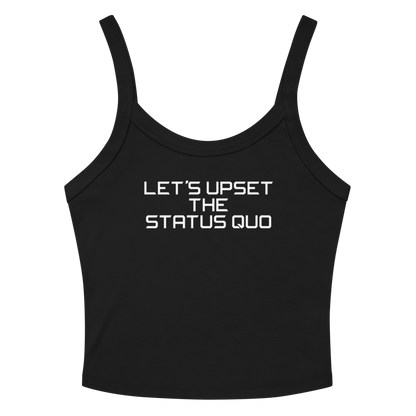 "Let's upset the status quo!" printed on a solid black blend women's micro-rib tanktop laying on a flat surface amongst sunglasses and shorts