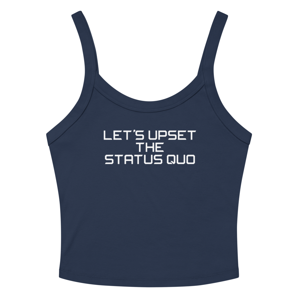 "Let's upset the status quo!" printed on a solid navy blend women's micro-rib tanktop laying on a flat surface amongst sunglasses and shorts
