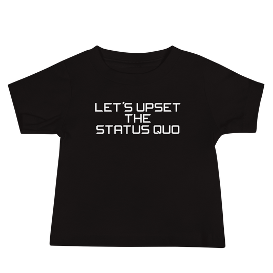 "Let's upset the status quo!" printed on a black baby jersey short sleeve tee laying on a flat surface