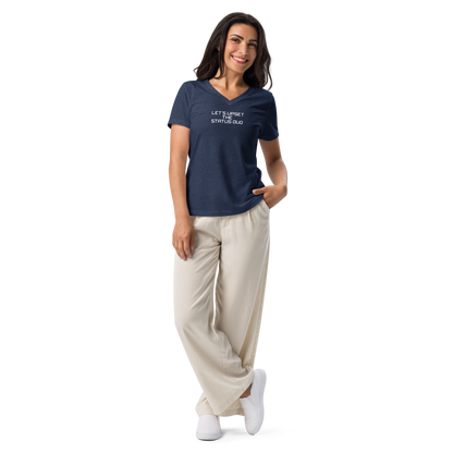 "Let's upset the status quo!" printed on a heather navy women's relaxed v-neck t-shirt worn by a female