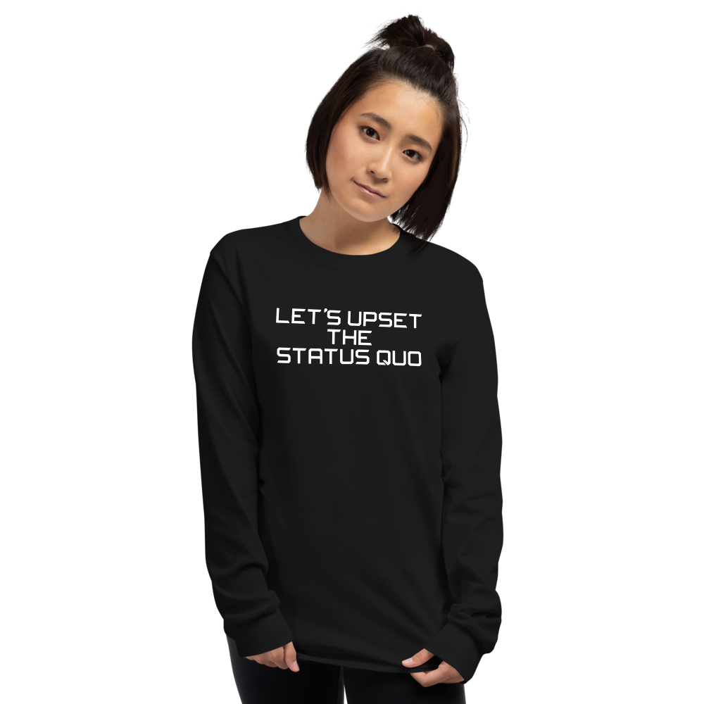 "Let's upset the status quo!" printed on a black men's long sleeve shirt worn by a female