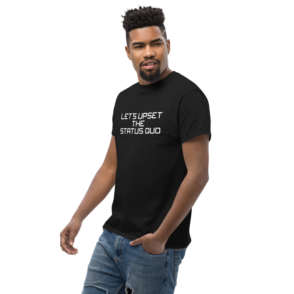 "Let's upset the status quo!" printed on a black unisex classic tee worn by a male