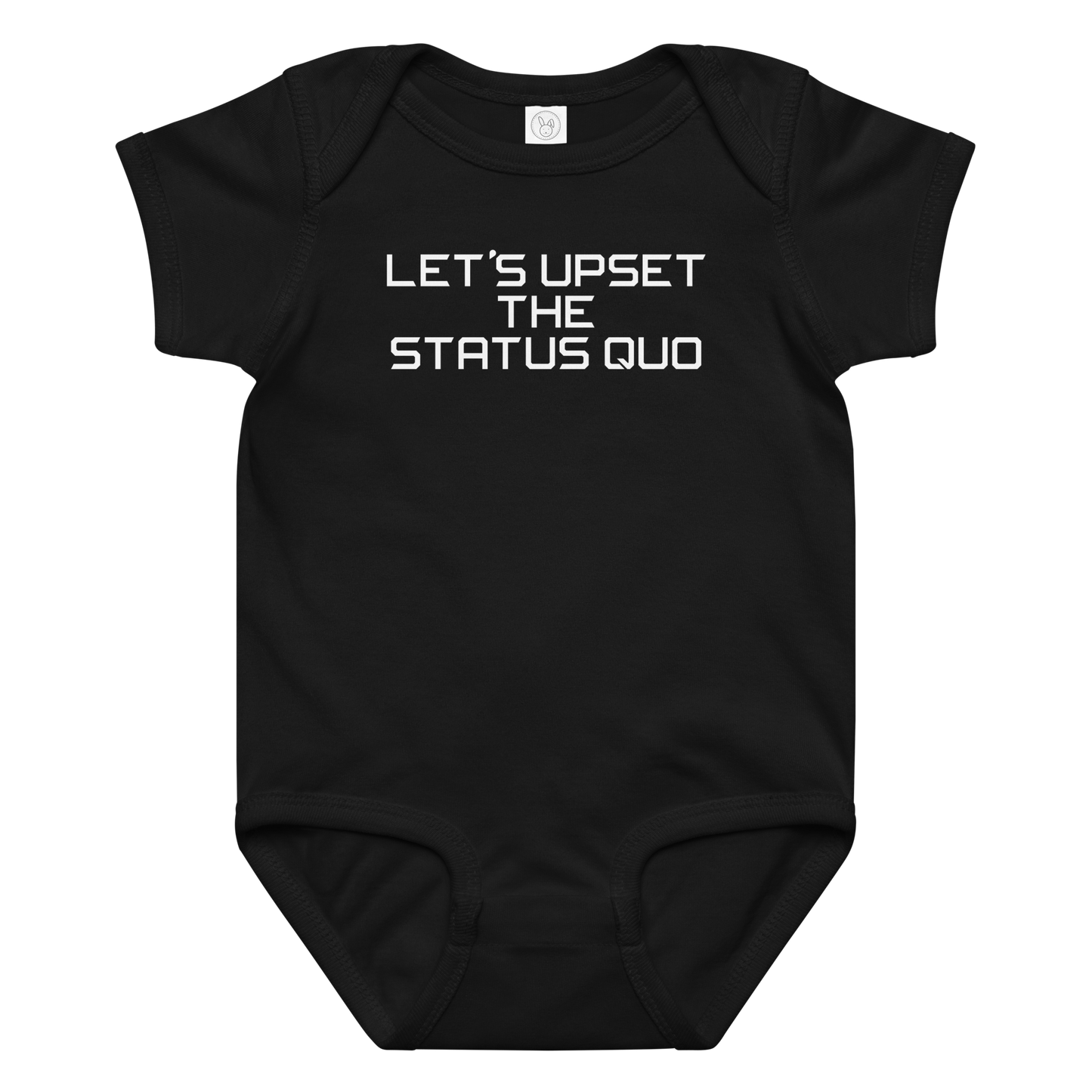 "Let's upset the status quo!" printed on a black baby jersey bodysuit laying on a flat surface amongst other clothes
