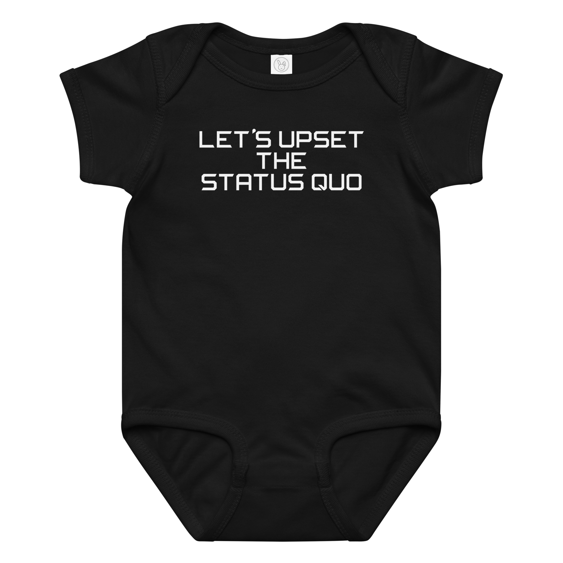"Let's upset the status quo!" printed on a black baby jersey bodysuit laying on a flat surface amongst other clothes