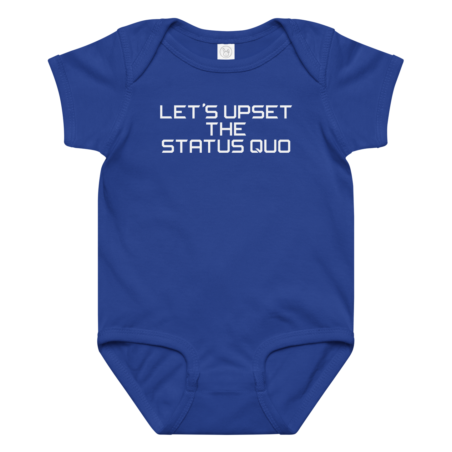 "Let's upset the status quo!" printed on a royal baby jersey bodysuit laying on a flat surface amongst other clothes