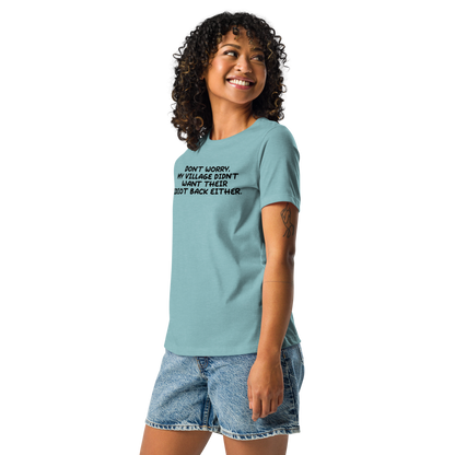 "Don't worry, my village didn’t want their idiot back either." printed on a heather blue lagoon women's relaxed t-shirt worn by a female