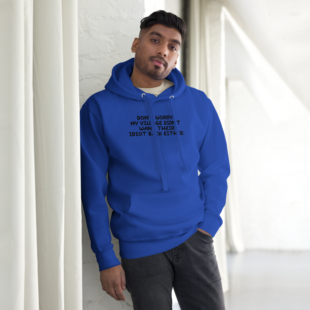 "Don't worry, my village didn’t want their idiot back either." printed on a team royal unisex hoodie worn by a male