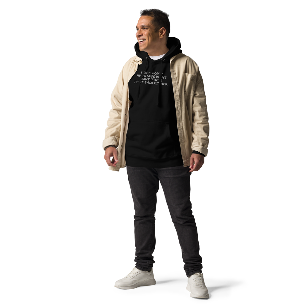 "Don't worry, my village didn’t want their idiot back either." printed on a black unisex hoodie worn by a male with a jacket on top