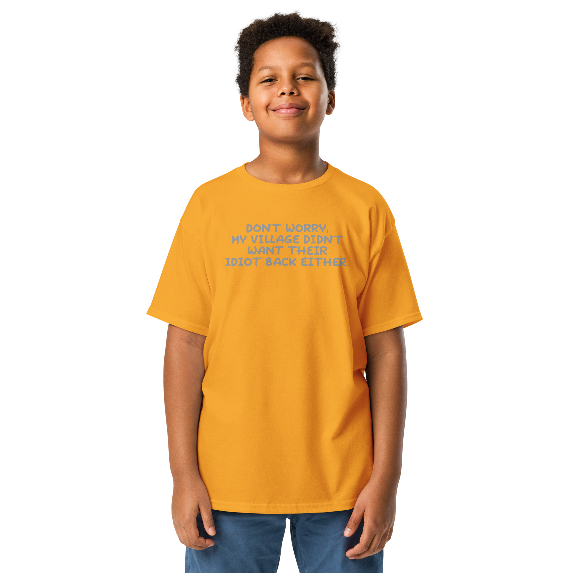 "Don't worry, my village didn’t want their idiot back either." printed on a gold youth classic tee worn by a male