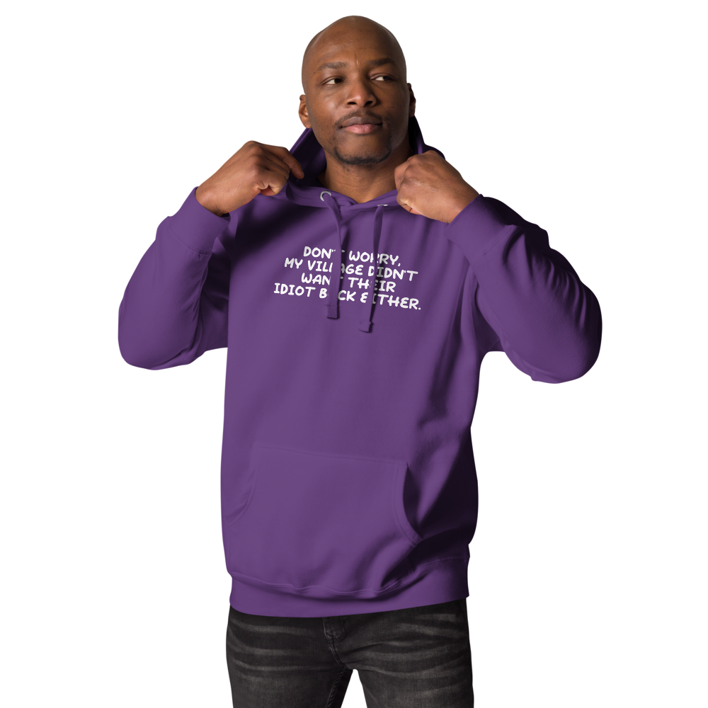 "Don't worry, my village didn’t want their idiot back either." printed on a purple unisex hoodie worn by a male
