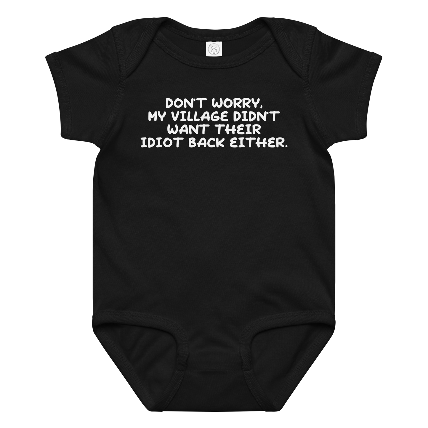 "Don't worry, my village didn’t want their idiot back either." printed on a black baby jersey bodysuit laying on a flat surface amongst other clothes