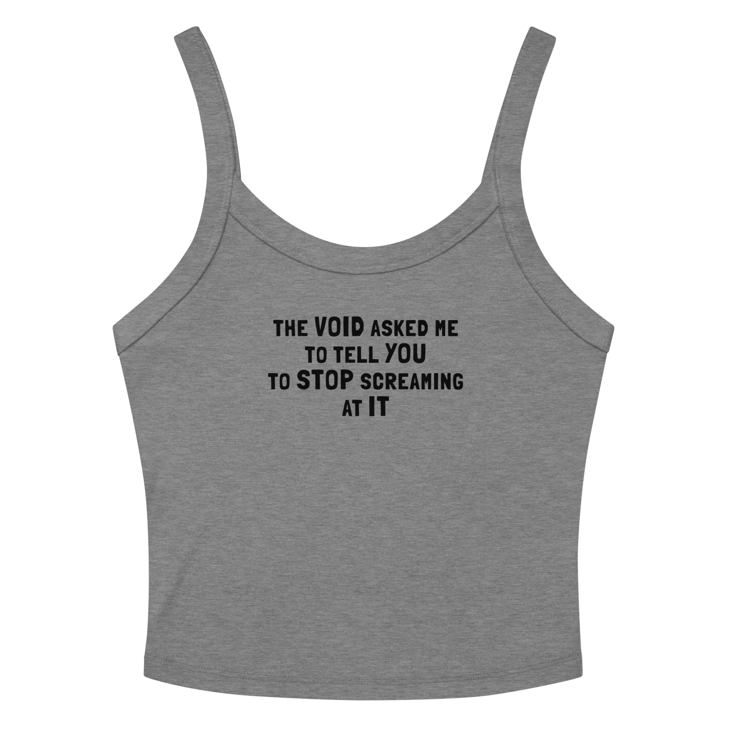 "The Void asked me to tell you to stop screaming at it" printed on a athletic heather women's micro-rib tanktop laying on a flat surface amongst sunglasses and shorts