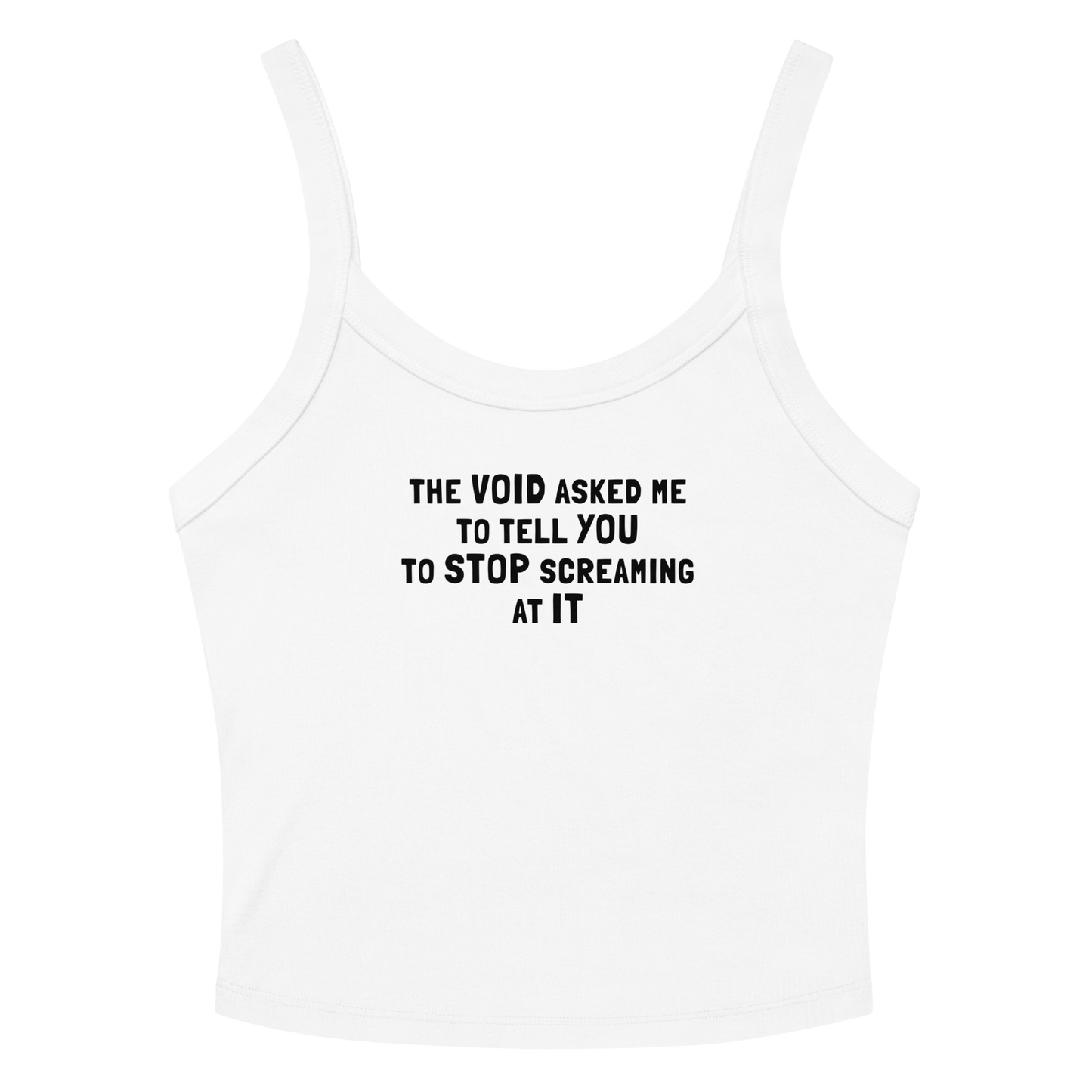 "The Void asked me to tell you to stop screaming at it" printed on a solid white blend women's micro-rib tanktop laying on a flat surface amongst sunglasses and shorts