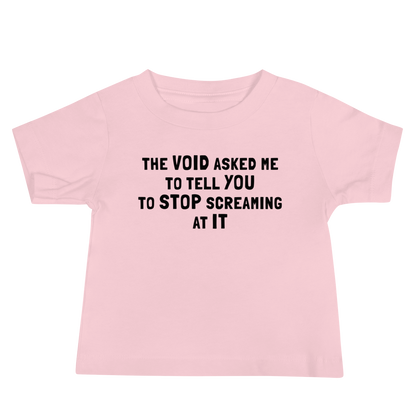 "The Void asked me to tell you to stop screaming at it" printed on a pink baby jersey short sleeve tee laying on a flat surface
