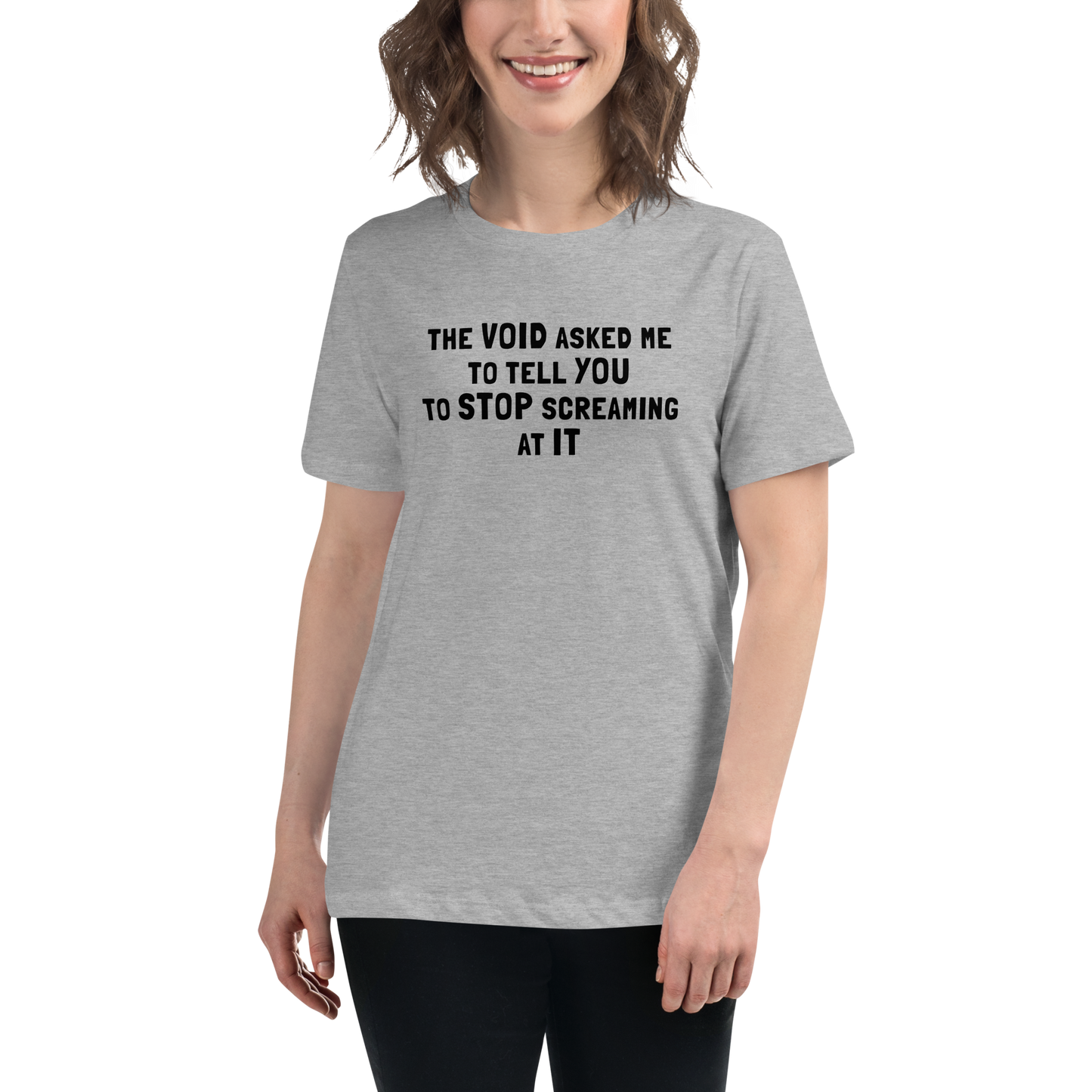 "The Void asked me to tell you to stop screaming at it" printed on a athletic heather women's relaxed t-shirt worn by a female