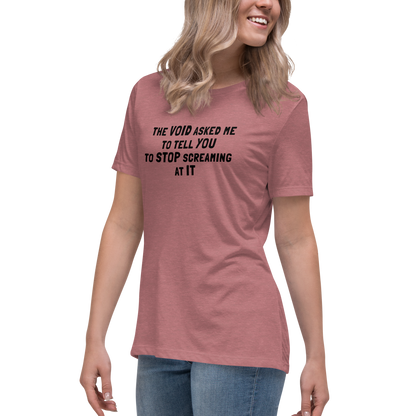 "The Void asked me to tell you to stop screaming at it" printed on a heather mauve women's relaxed t-shirt worn by a female