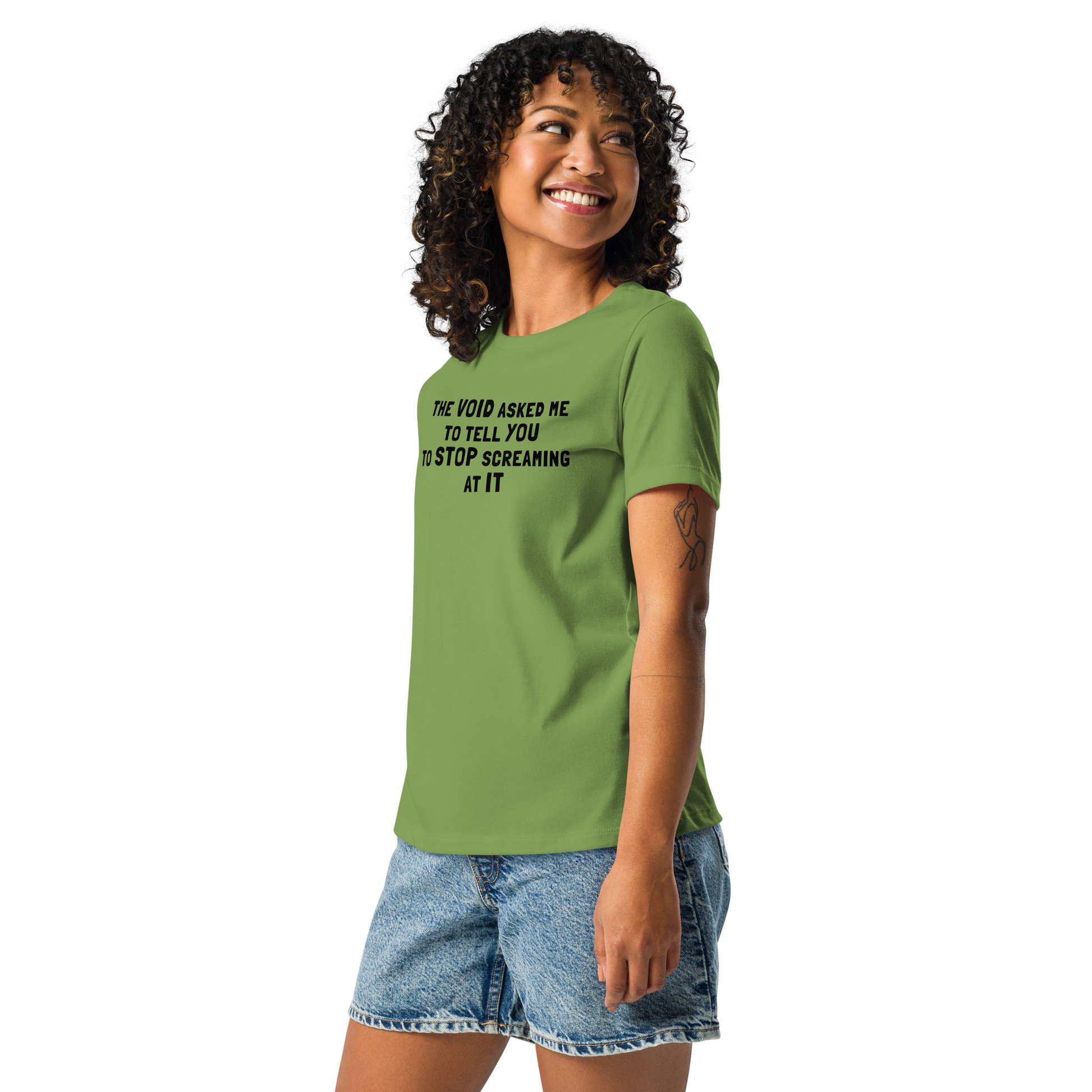 "The Void asked me to tell you to stop screaming at it" printed on a leaf women's relaxed t-shirt worn by a female