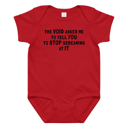 "The Void asked me to tell you to stop screaming at it" printed on a red baby jersey bodysuit laying on a flat surface amongst other clothes