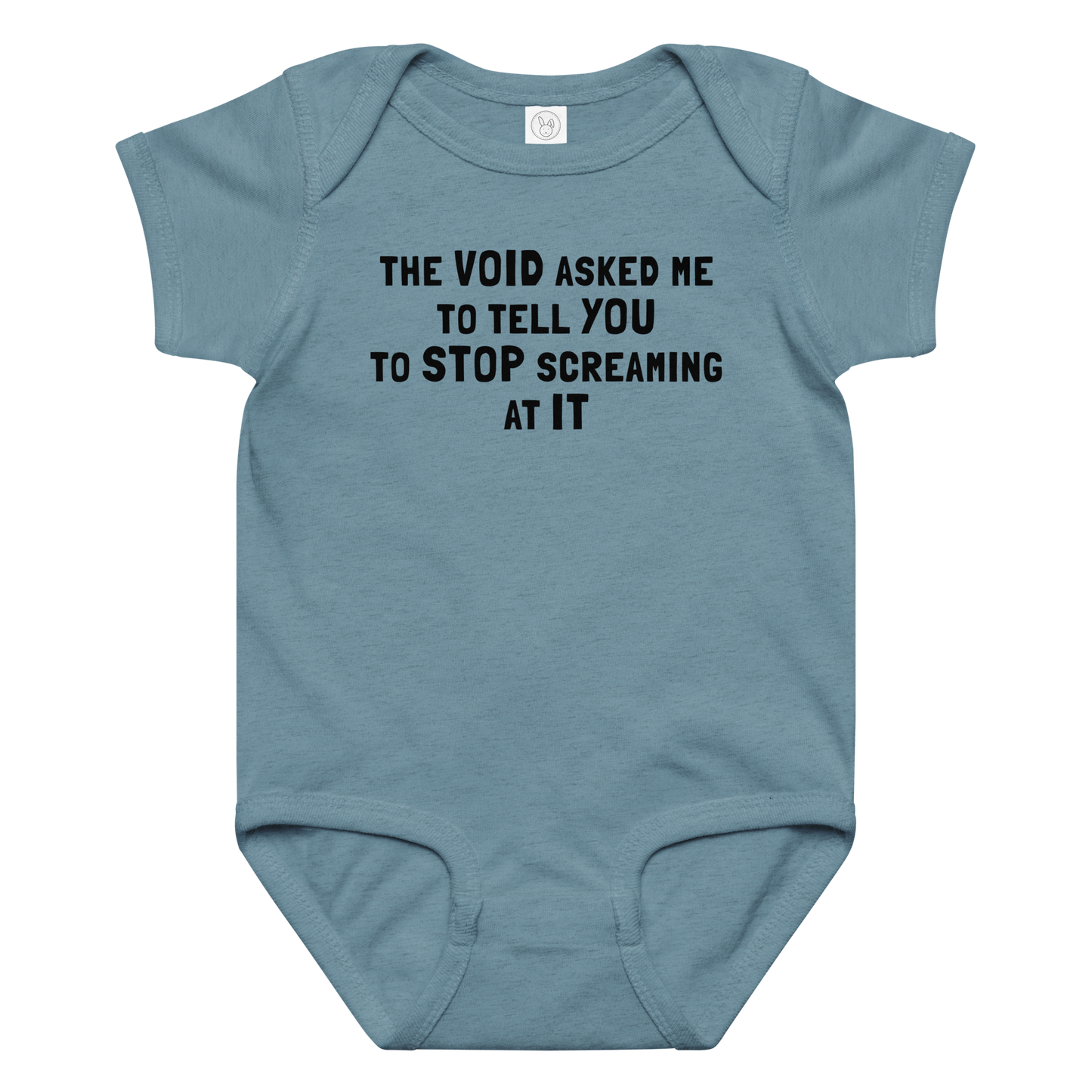 "The Void asked me to tell you to stop screaming at it" printed on a vintage indigo baby jersey bodysuit laying on a flat surface amongst other clothes
