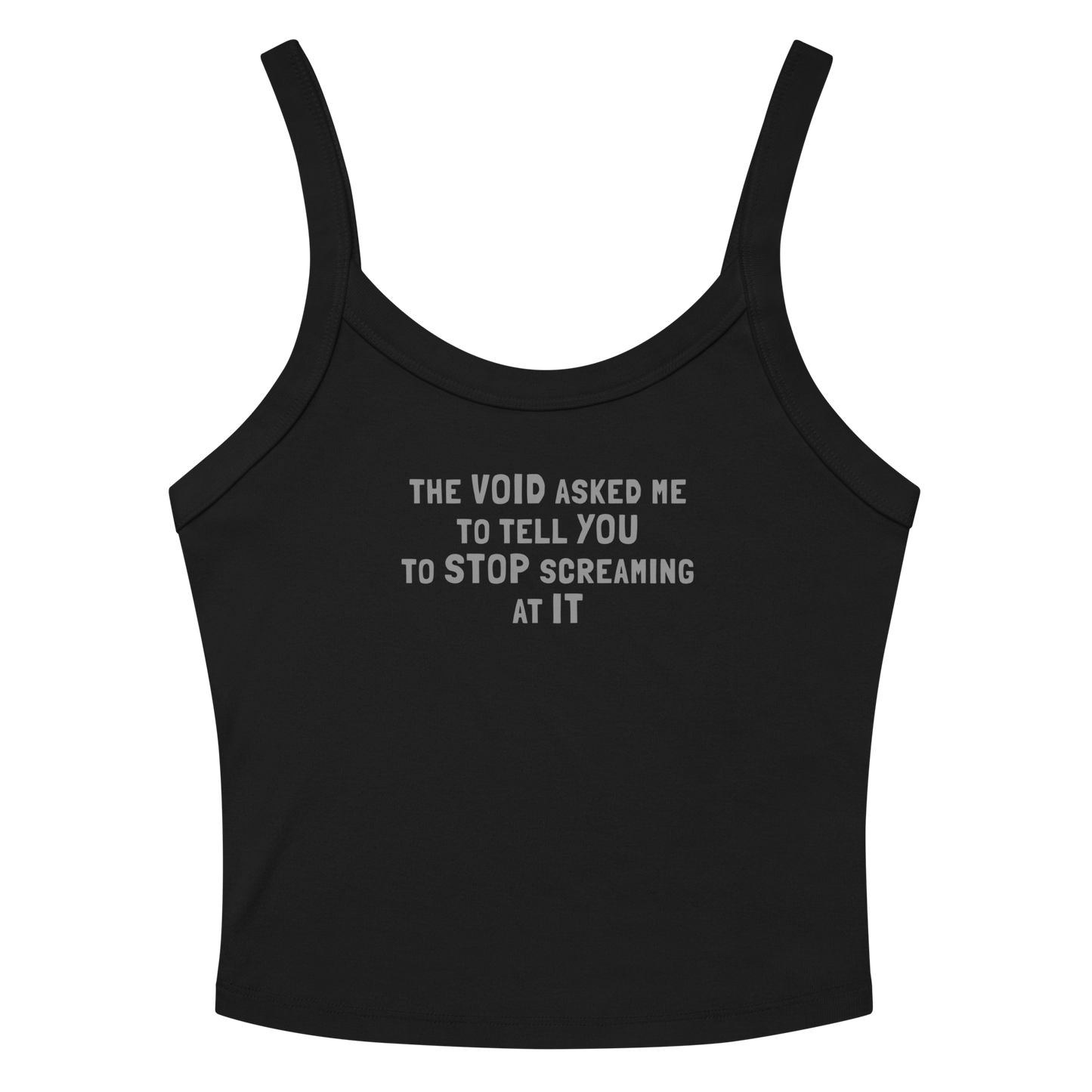 "The Void asked me to tell you to stop screaming at it" printed on a solid black blend women's micro-rib tanktop laying on a flat surface amongst sunglasses and shorts