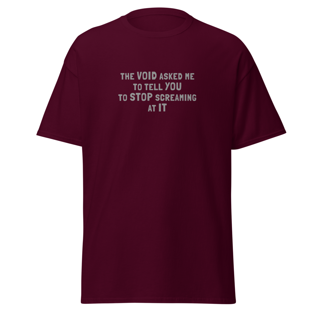 "The Void asked me to tell you to stop screaming at it" printed on a maroon on an invisible body