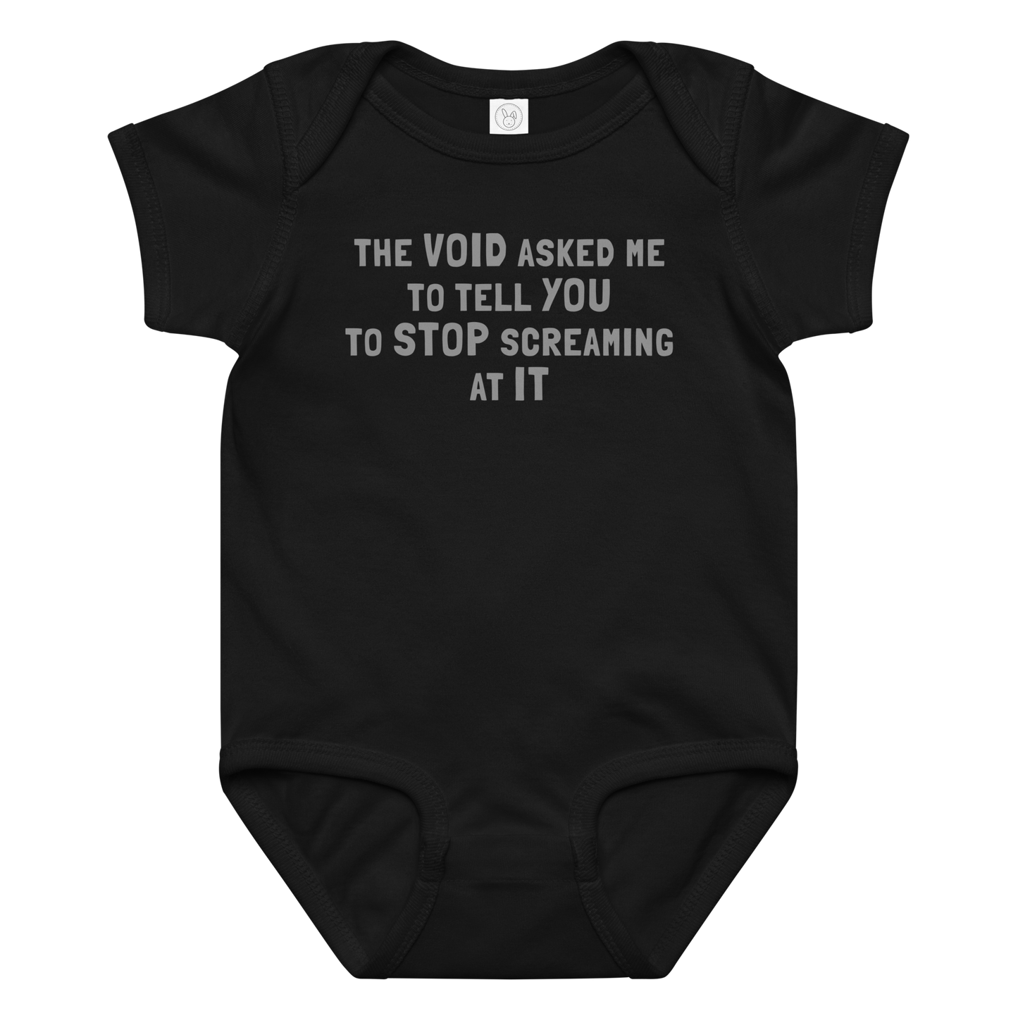 "The Void asked me to tell you to stop screaming at it" printed on a black baby jersey bodysuit laying on a flat surface amongst other clothes