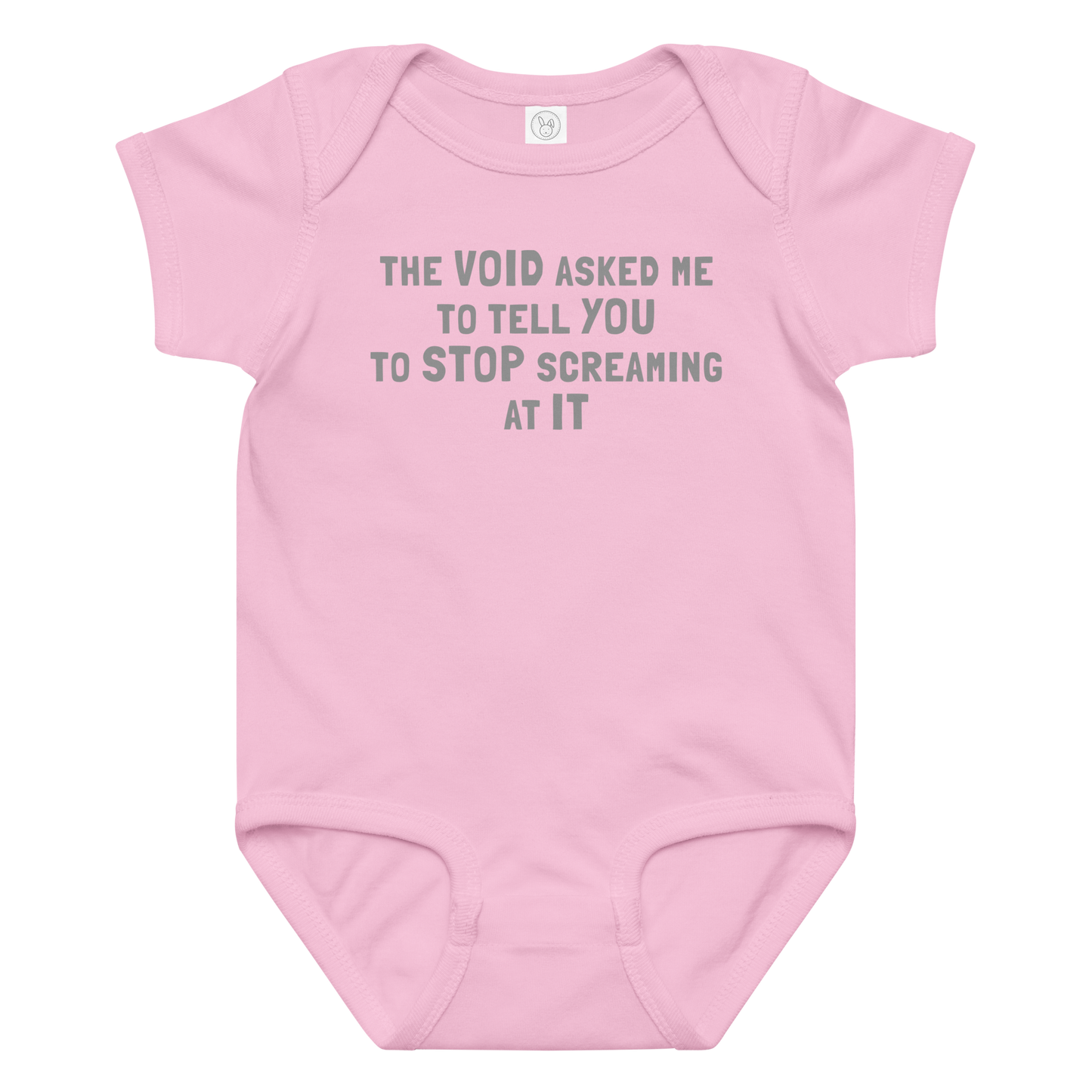 "The Void asked me to tell you to stop screaming at it" printed on a pink baby jersey bodysuit laying on a flat surface amongst other clothes