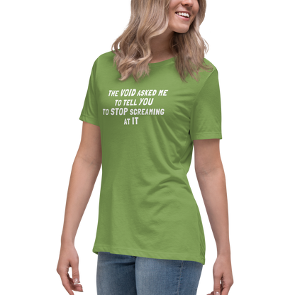 "The Void asked me to tell you to stop screaming at it" printed on a leaf women's relaxed t-shirt worn by a female