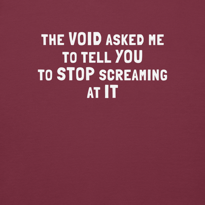 "The Void asked me to tell you to stop screaming at it" printed on a maroon background