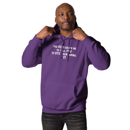 "The Void asked me to tell you to stop screaming at it" printed on a purple unisex hoodie worn by a male