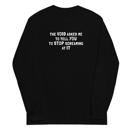 "The Void asked me to tell you to stop screaming at it" printed on a black men's long sleeve shirt laying on a flat surface