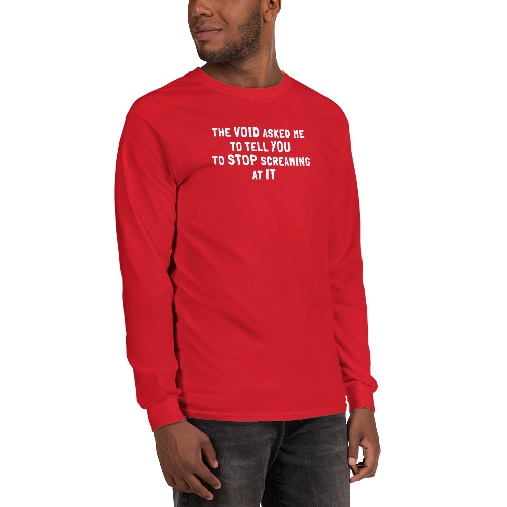 "The Void asked me to tell you to stop screaming at it" printed on a red men's long sleeve shirt worn by a male