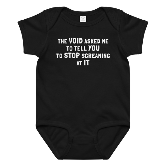 "The Void asked me to tell you to stop screaming at it" printed on a black baby jersey bodysuit laying on a flat surface amongst other clothes