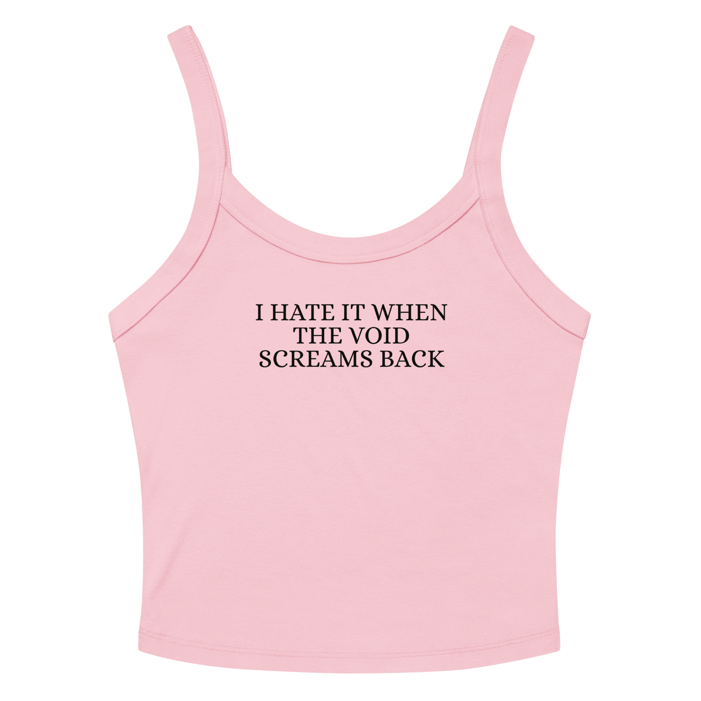 "I hate it when the void screams back" printed on a solid pink blend women's micro-rib tanktop laying on a flat surface amongst sunglasses and shorts
