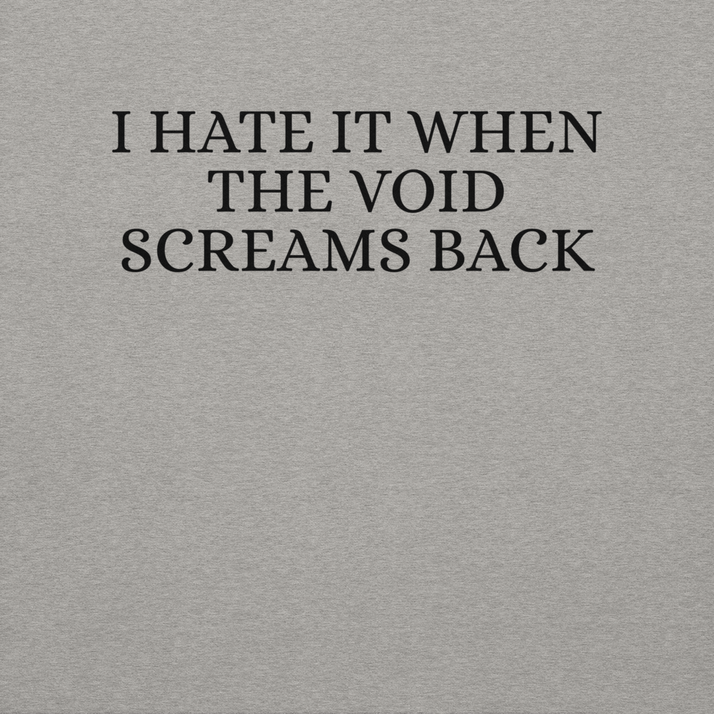 "I hate it when the void screams back" printed on a carbon grey background