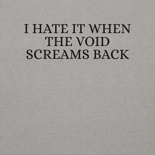 "I hate it when the void screams back" printed on a carbon grey background