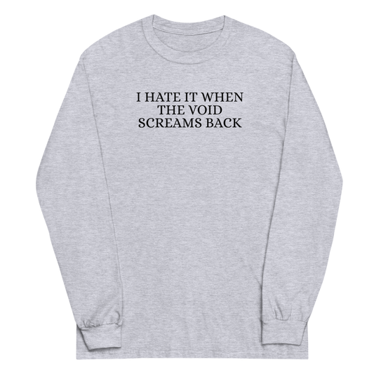 "I hate it when the void screams back" printed on a sport grey men's long sleeve shirt laying on a flat surface