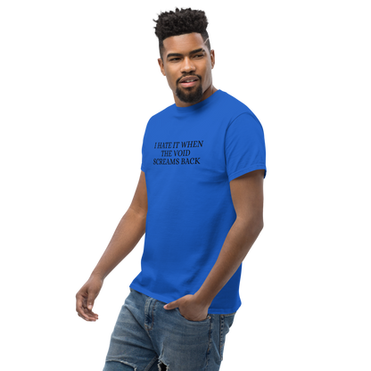 "I hate it when the void screams back" printed on a royal unisex classic tee worn by a male