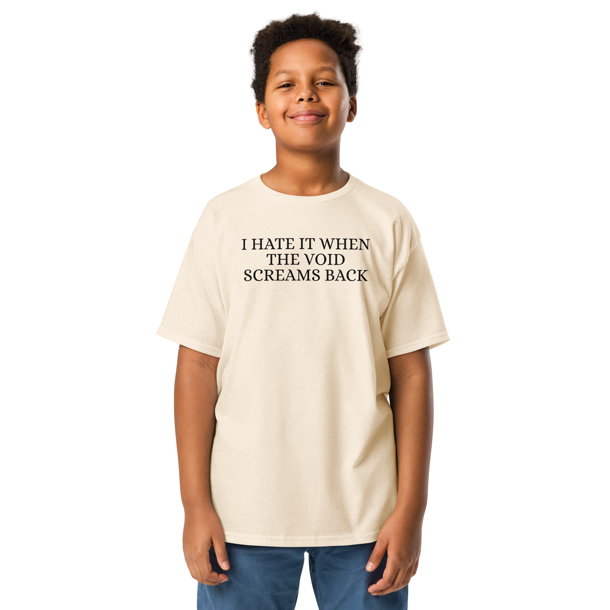 "I hate it when the void screams back" printed on a natural youth classic tee worn by a male