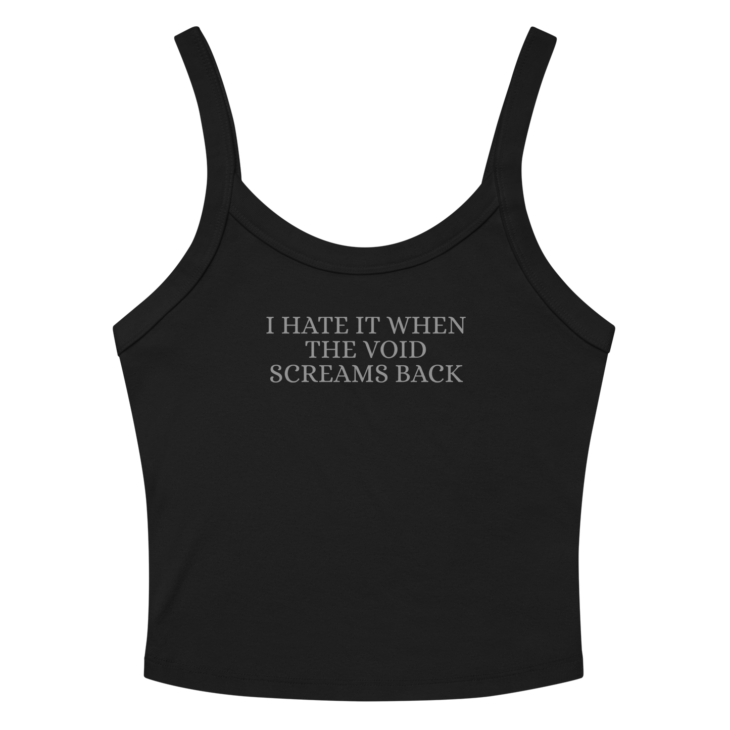 "I hate it when the void screams back" printed on a solid black blend women's micro-rib tanktop laying on a flat surface amongst sunglasses and shorts