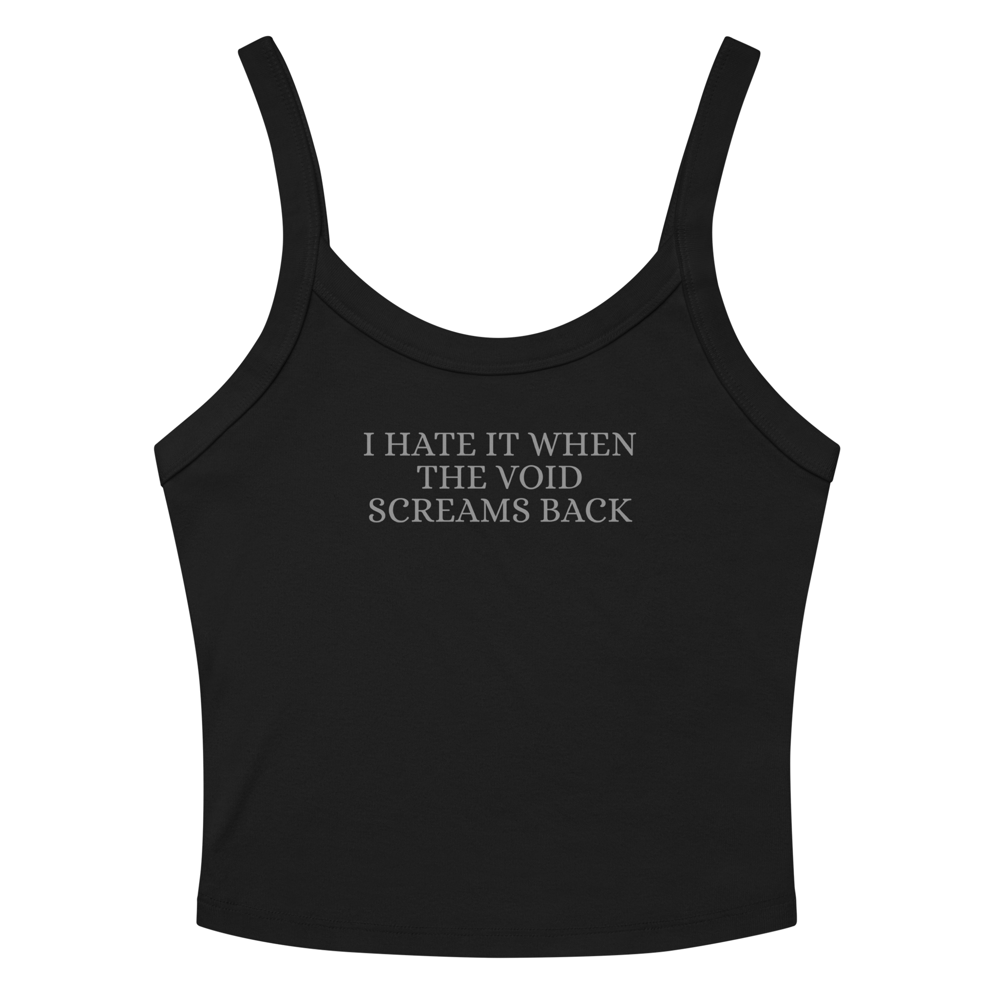 "I hate it when the void screams back" printed on a solid black blend women's micro-rib tanktop laying on a flat surface amongst sunglasses and shorts
