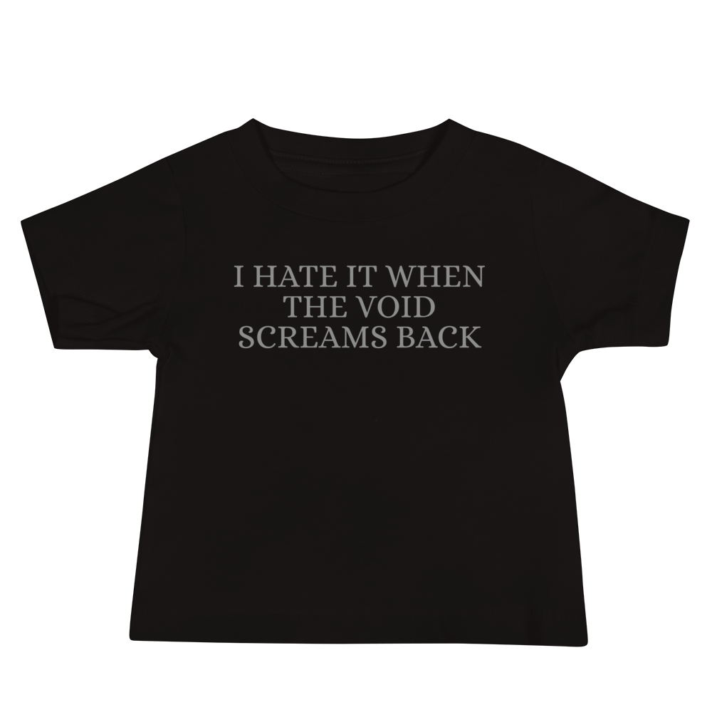 "I hate it when the void screams back" printed on a black baby jersey short sleeve tee laying on a flat surface