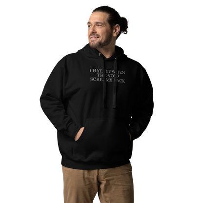 "I hate it when the void screams back" printed on a black unisex hoodie worn by a male