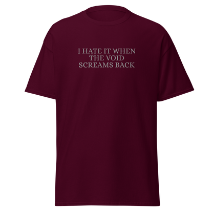 "I hate it when the void screams back" printed on a maroon on an invisible body
